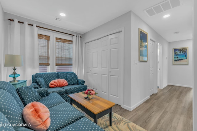 living room with light hardwood / wood-style flooring