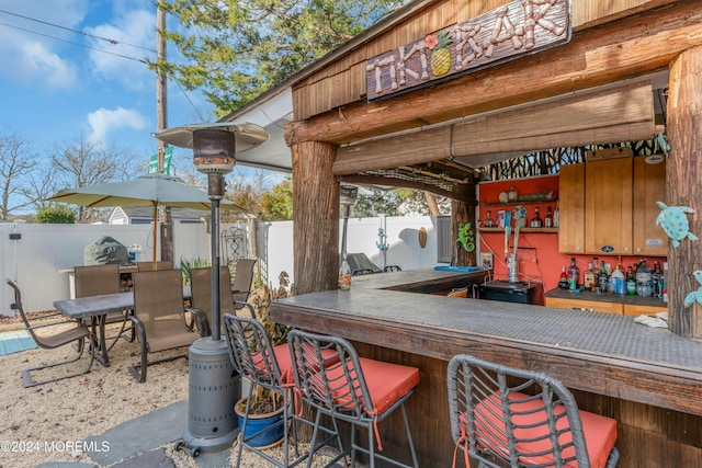 view of patio featuring exterior bar