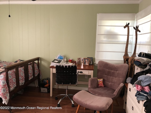 bedroom featuring ornamental molding and dark wood-type flooring