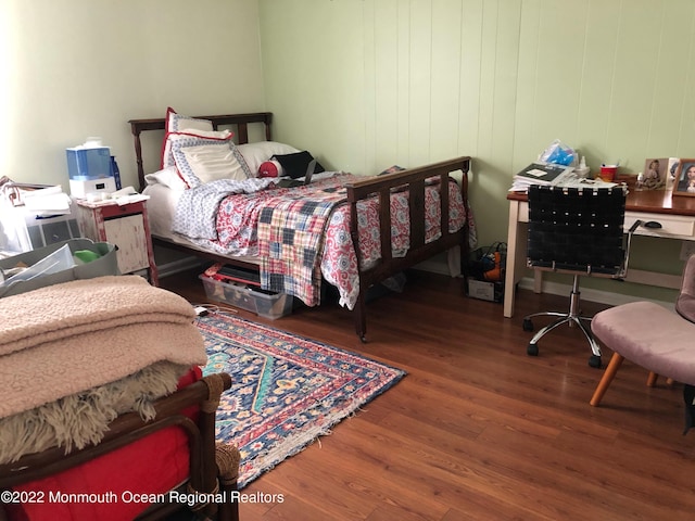 bedroom with hardwood / wood-style flooring