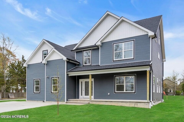 view of front of home with covered porch and a front yard