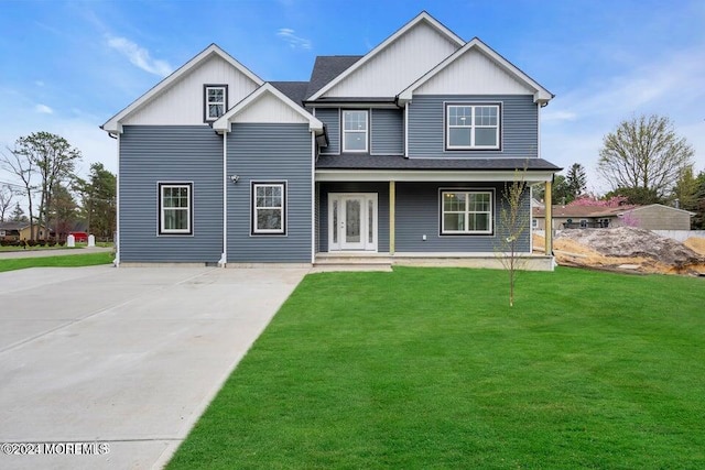 view of front facade with covered porch and a front lawn