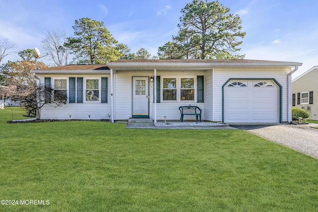 single story home featuring a garage and a front yard