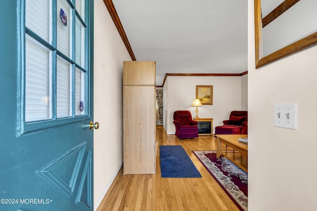 interior space with crown molding and hardwood / wood-style floors