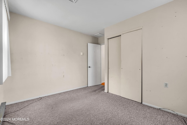 unfurnished bedroom with carpet flooring