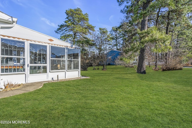 view of yard featuring a sunroom