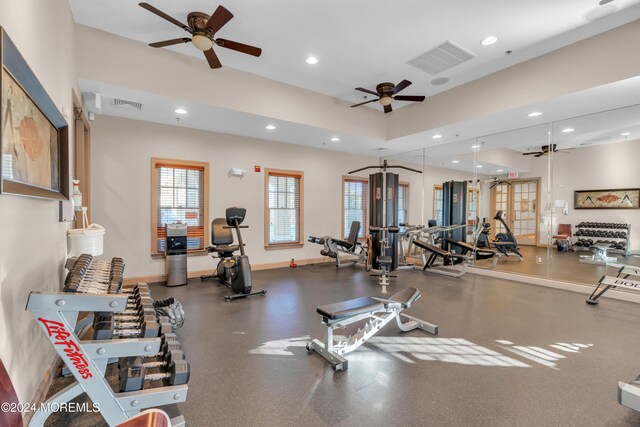 exercise room with ceiling fan