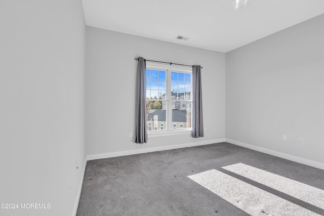 unfurnished room with carpet flooring