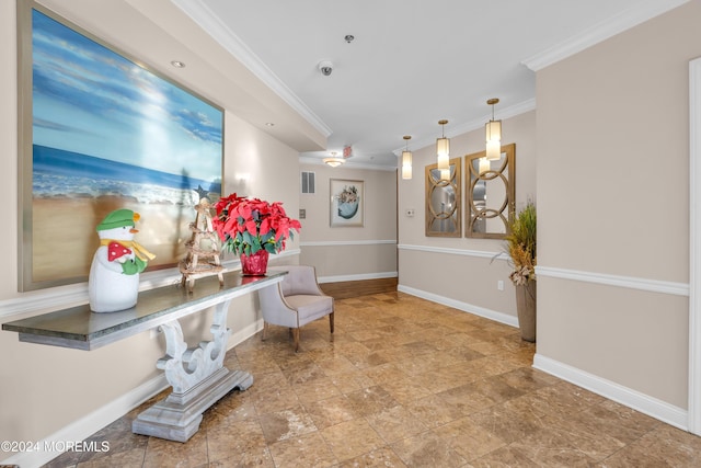 living area with ornamental molding