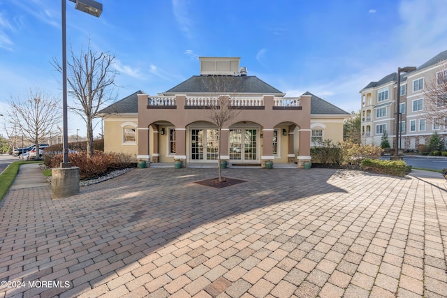 back of house featuring french doors