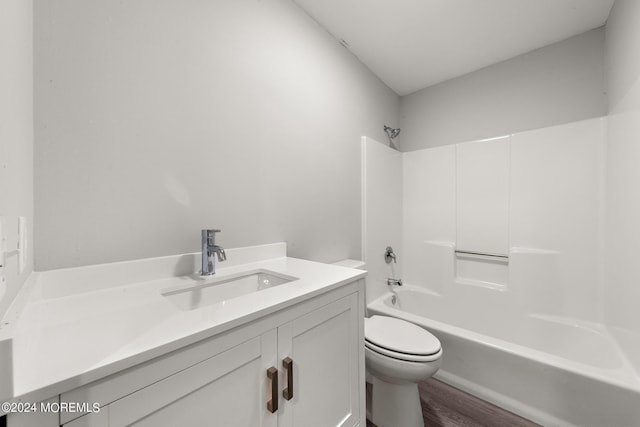 full bathroom featuring vanity, toilet, wood-type flooring, and tub / shower combination