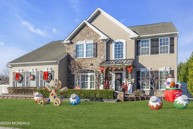 view of front of property with a front lawn