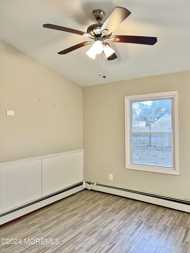 spare room featuring light hardwood / wood-style floors and ceiling fan