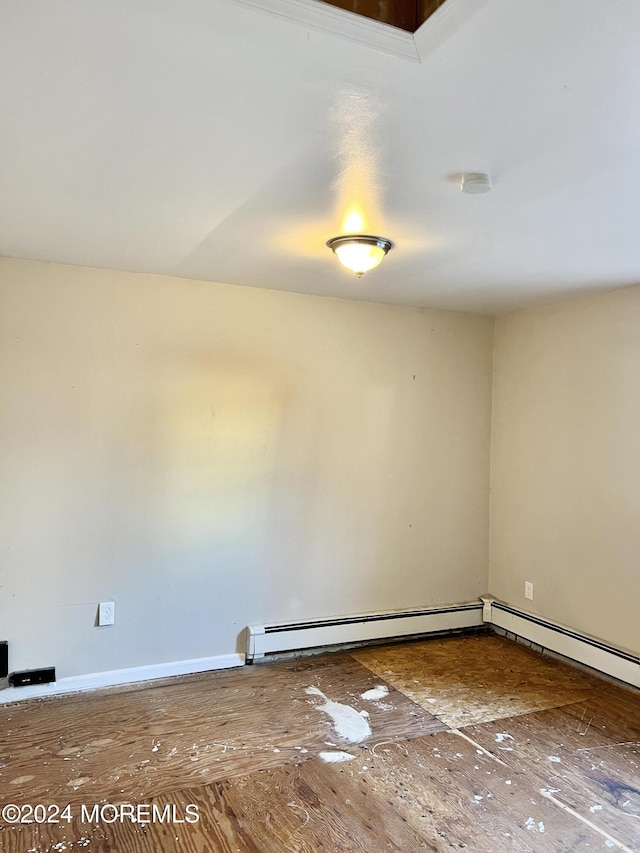 empty room featuring a baseboard radiator