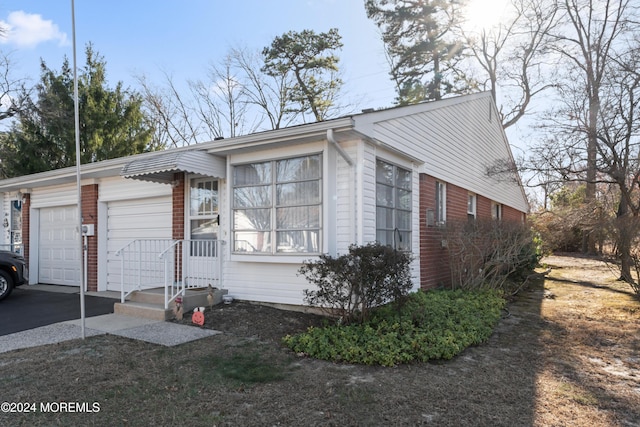 view of front of property with a garage