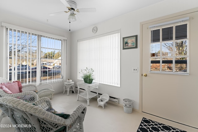 living area with ceiling fan and carpet