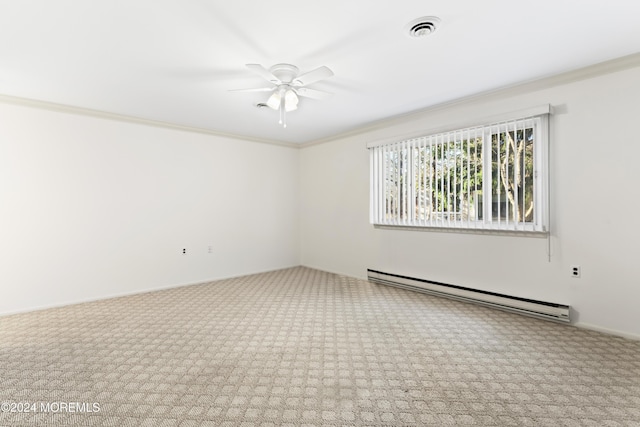 empty room featuring ceiling fan, crown molding, carpet floors, and a baseboard heating unit