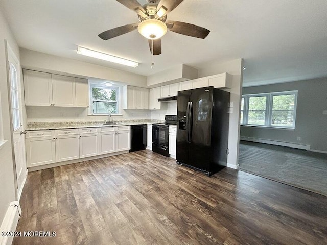 kitchen featuring white cabinetry, dark wood-type flooring, black appliances, and a baseboard radiator