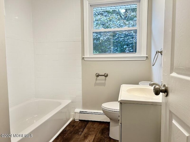 full bathroom with baseboard heating, vanity, hardwood / wood-style floors, toilet, and shower / bathing tub combination