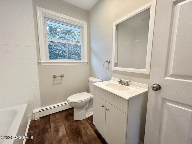 bathroom with hardwood / wood-style floors, vanity, a bathtub, toilet, and a baseboard radiator