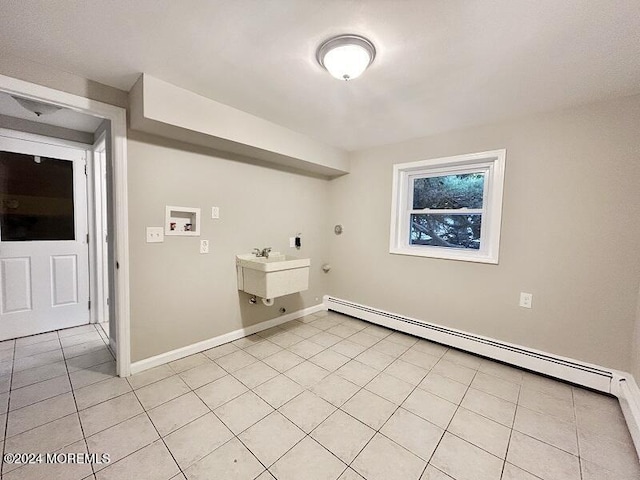 washroom featuring sink, baseboard heating, gas dryer hookup, hookup for a washing machine, and light tile patterned floors