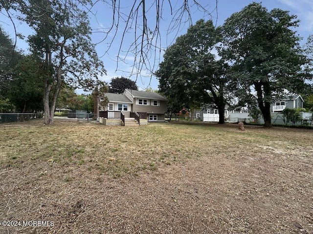 view of yard featuring a wooden deck