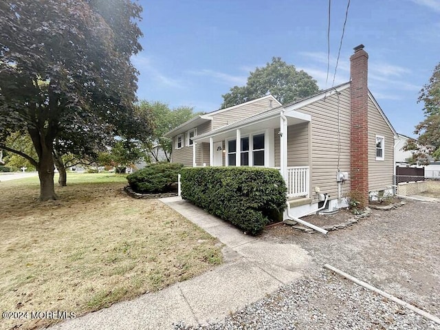 view of home's exterior featuring a porch