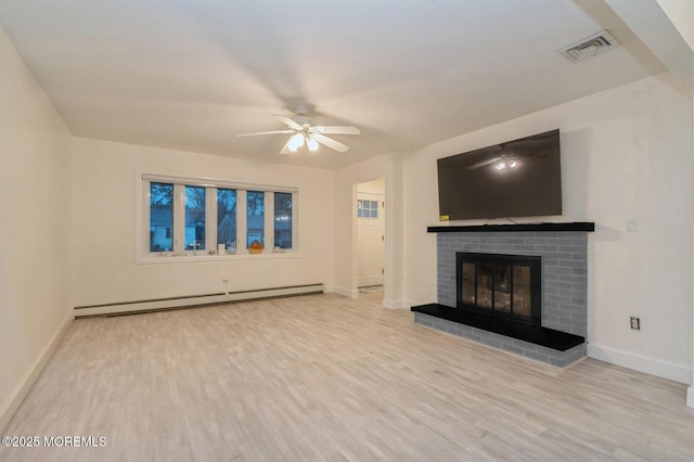 unfurnished living room featuring ceiling fan, a brick fireplace, baseboard heating, and light hardwood / wood-style flooring