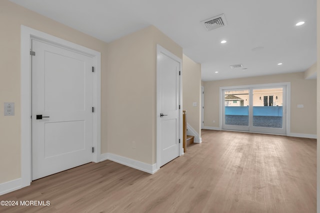 hall with light hardwood / wood-style floors