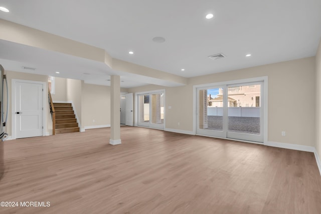 unfurnished living room with light hardwood / wood-style flooring