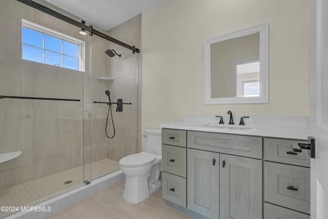 full bath featuring a stall shower, toilet, and vanity