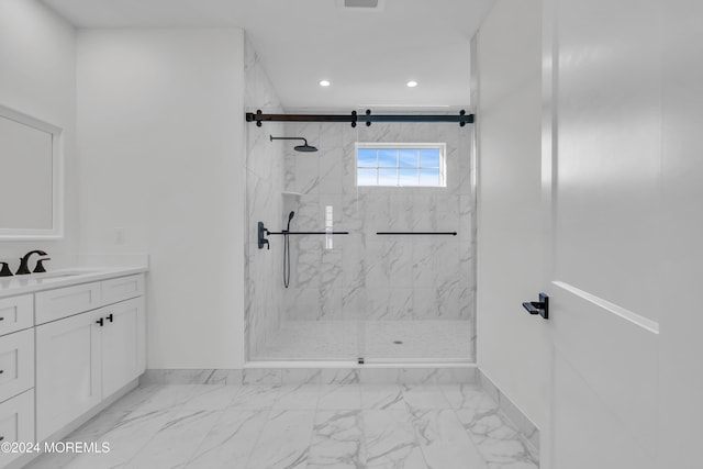 bathroom with vanity and an enclosed shower