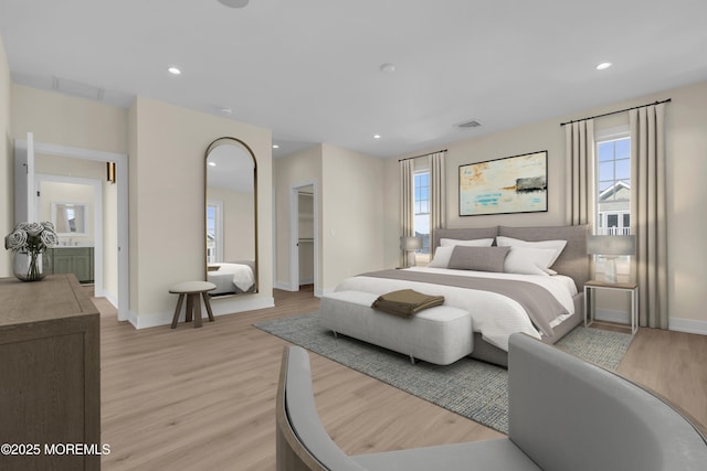 bedroom with light wood-style flooring, multiple windows, recessed lighting, and baseboards