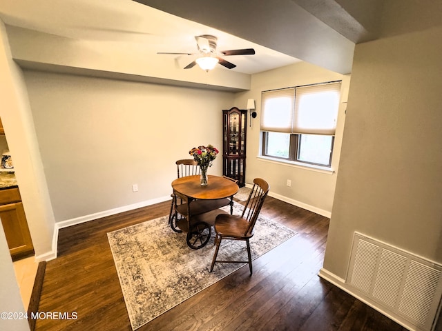 dining room featuring ceiling fan and dark hardwood / wood-style floors