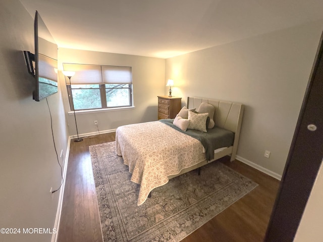 bedroom featuring dark hardwood / wood-style floors