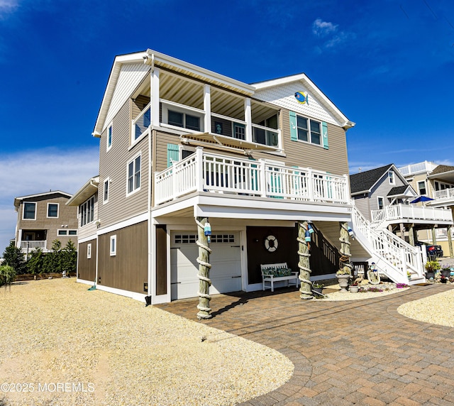 view of front of home with covered porch and a garage