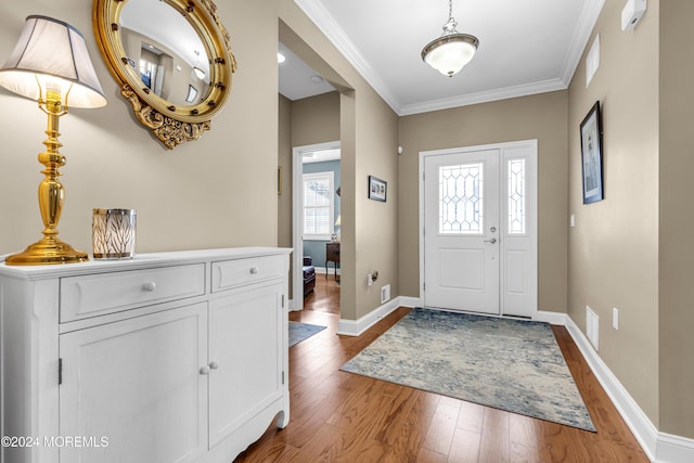 foyer featuring hardwood / wood-style floors and ornamental molding