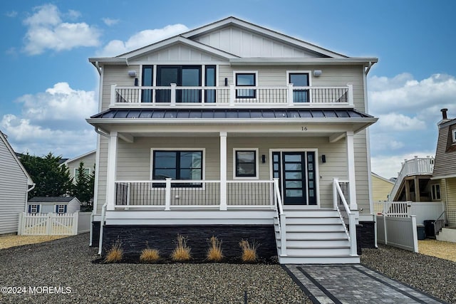 view of front of house with covered porch and a balcony