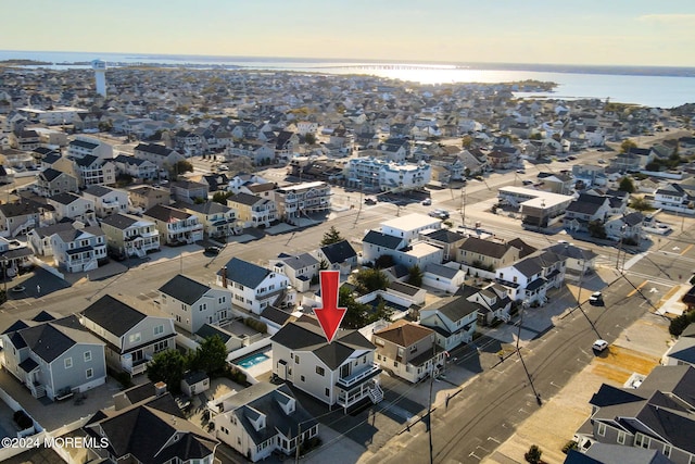 aerial view at dusk with a water view