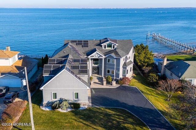 drone / aerial view with a water view and a residential view