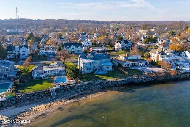 birds eye view of property with a residential view and a water view