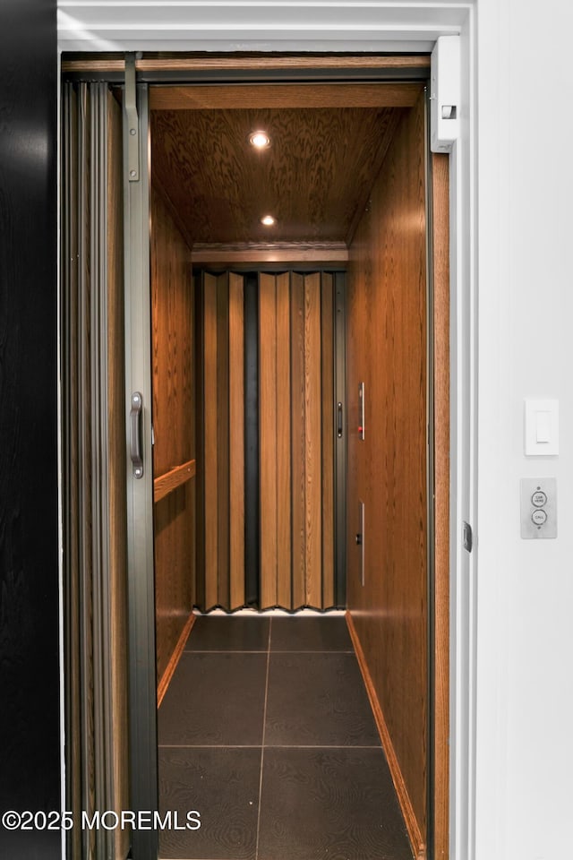 room details featuring elevator and recessed lighting