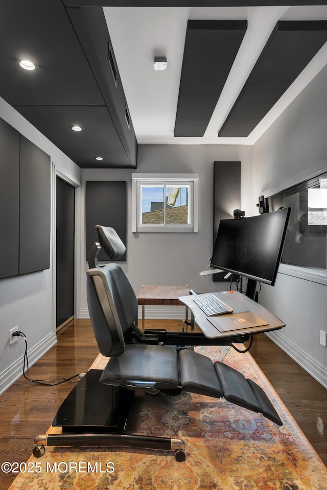 home office featuring visible vents, baseboards, and wood finished floors