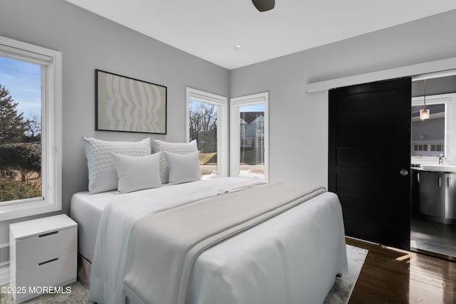 bedroom featuring wood finished floors