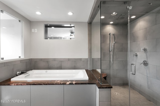 full bath with a garden tub, recessed lighting, visible vents, and a stall shower