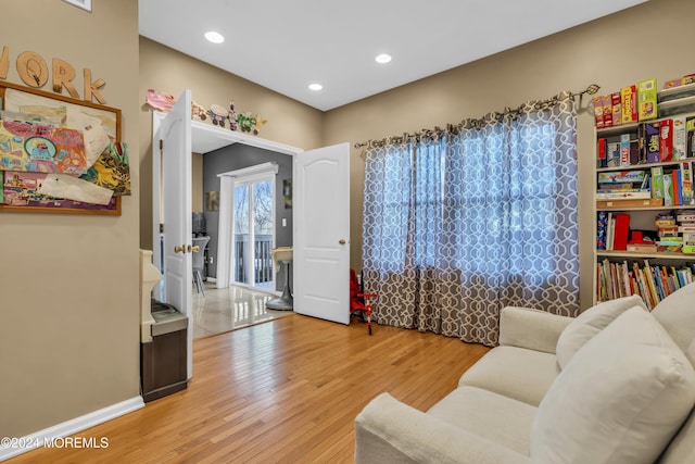 living area with light hardwood / wood-style floors