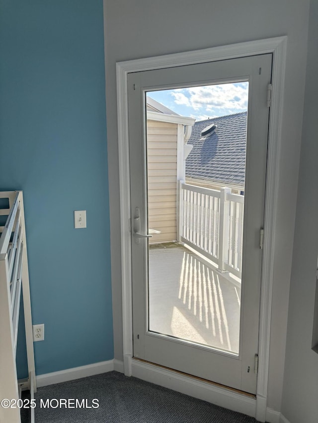 doorway featuring carpet