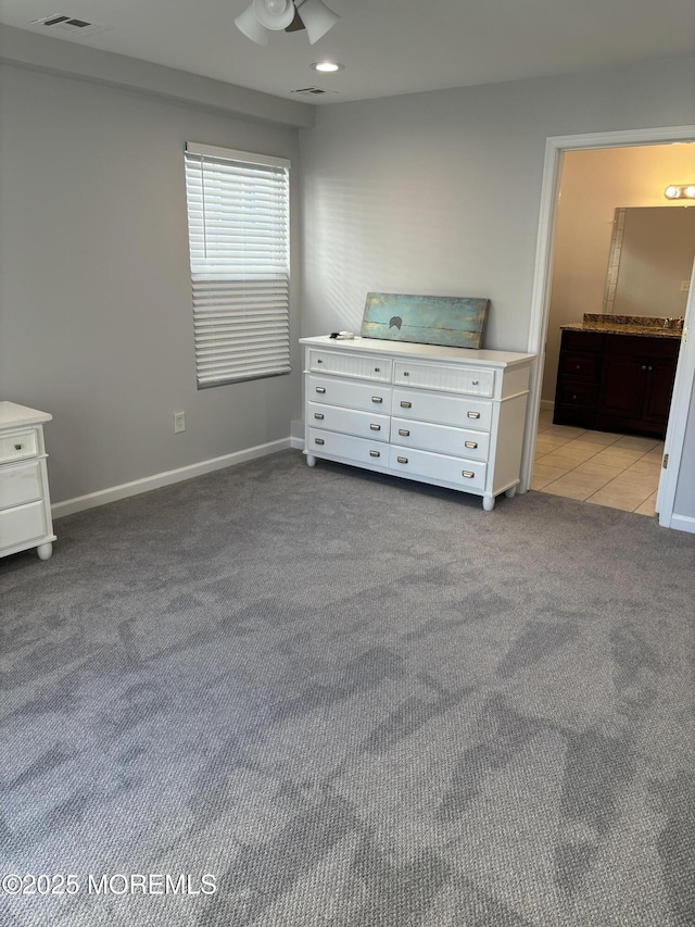 unfurnished bedroom with light colored carpet