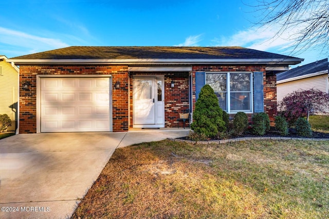 ranch-style house featuring a garage