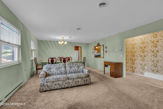 living room with a chandelier, carpet, and a baseboard heating unit